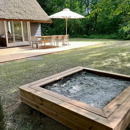 Be Surrounded By Trees In A Thatched Holiday home