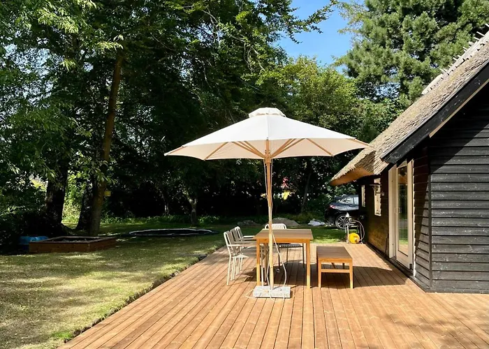 Be Surrounded By Trees In A Thatched Ferienhaus Nykøbing Sjælland